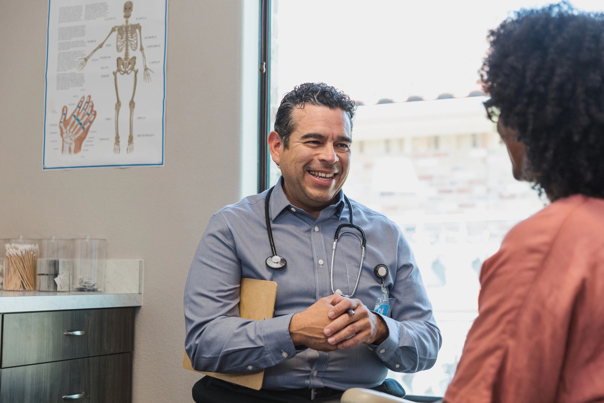 Doctor listening to a patient during a clinic visit