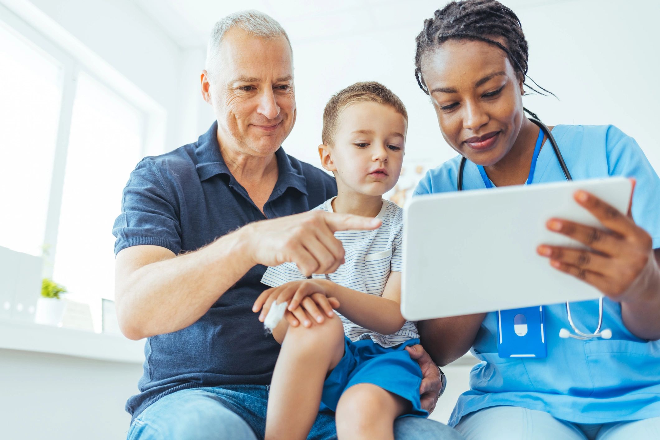 Parent and child with a doctor during a pediatric checkup