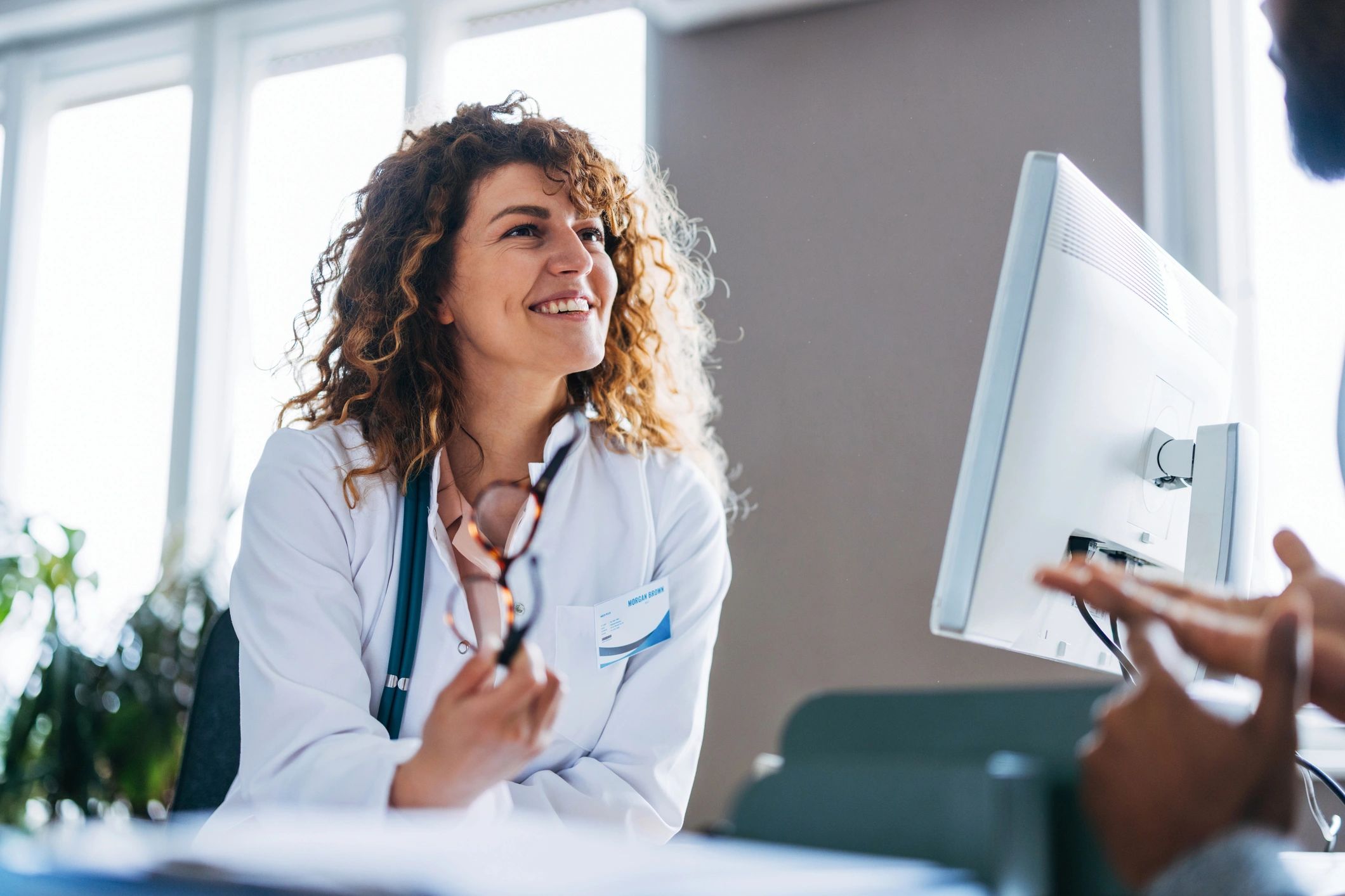 Doctor speaking with a patient during a consultation at a clinic
