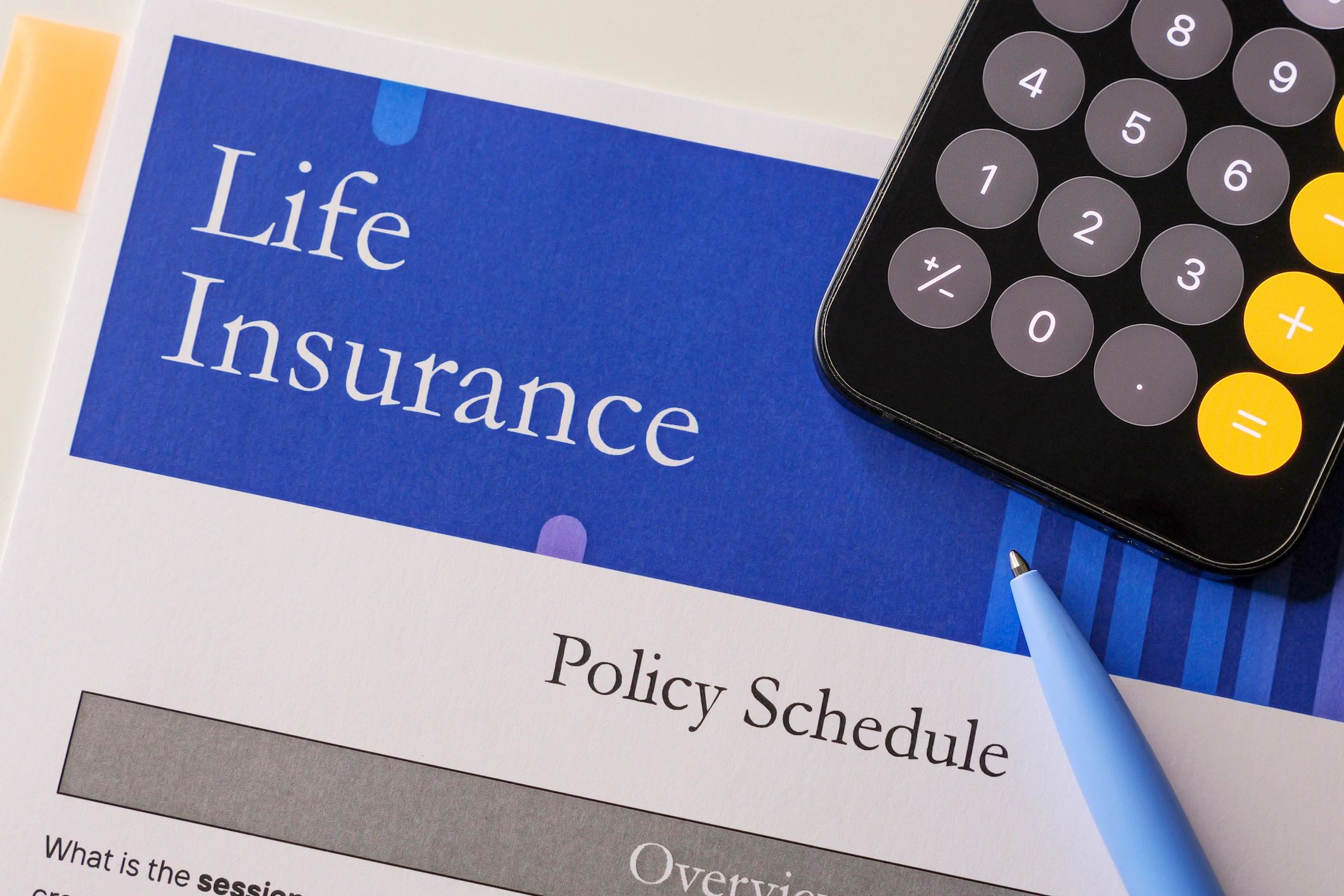 Close-up of insurance paperwork and documents on a desk